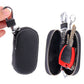 Black leather-look key holder wallets set with zipper closures and metal keyrings
