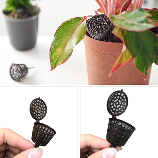 Dark perforated bonsai fertilizer dispenser with round cover, shown in hand