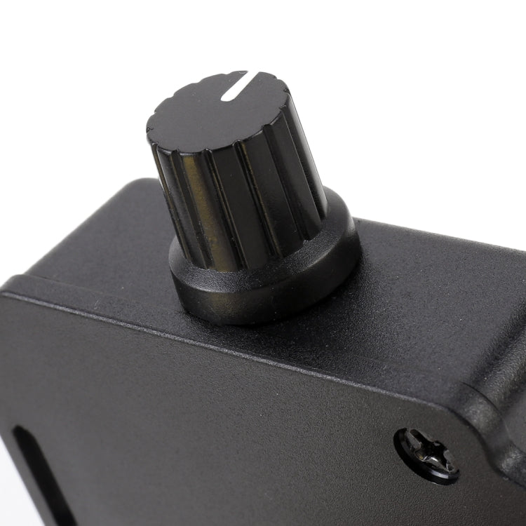 Rotary volume knob on black car audio volume control module housing