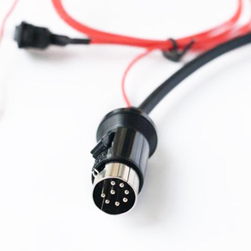 8-pin connector end on car Bluetooth AUX adapter cable with black circular plug