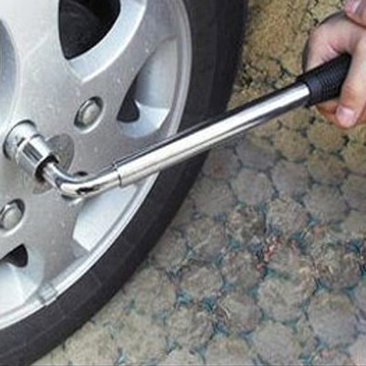 Telescoping wheel lug wrench with black nonslip handle and socket end, used on car wheel
