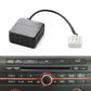 Car Bluetooth audio adapter module connected to an AUX interface cable