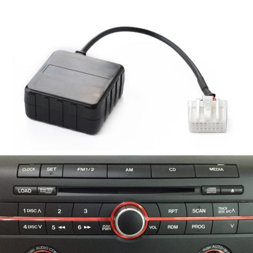 Car Bluetooth audio adapter module connected to an AUX interface cable