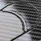 Close-up of oval carbon-fiber style car lock body sticker, black with white edge line