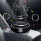 Black spiral car aromatherapy ornament on dashboard with vapor-like smoke effects