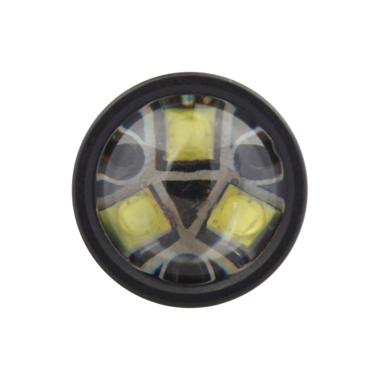 Close-up of LED fog light projector lens with four yellow LED chips
