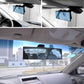 Installed interior rear view mirror showing a blue-tinted reflection in the car
