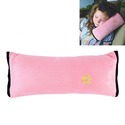 Pink plush children’s neck support pillow with black trim and small yellow sun logo