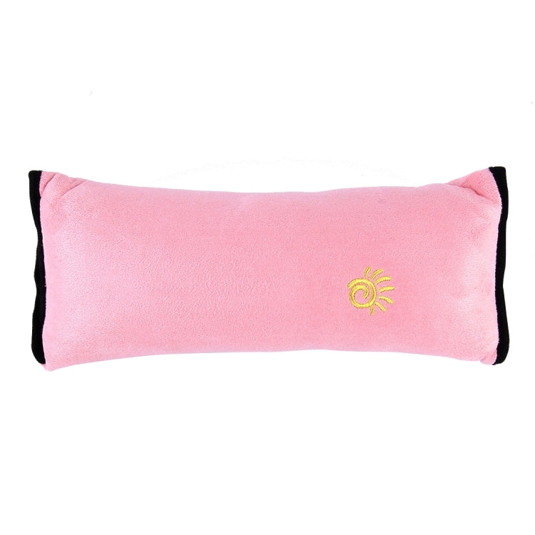 Pink plush headrest neck support pillow with black trim and yellow sun emblem