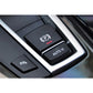 Auto H switch cover button in car console, black with “AUTO H” text