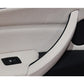 Car door armrest pull handle in beige near power window switch