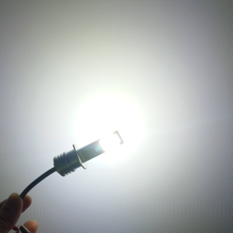 H1 LED fog light bulb emitting bright white beam from the lens