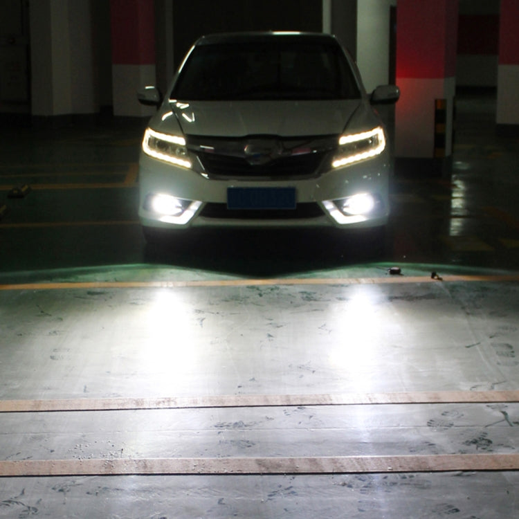 Vehicle front with illuminated LED fog lights from installed H1 bulbs