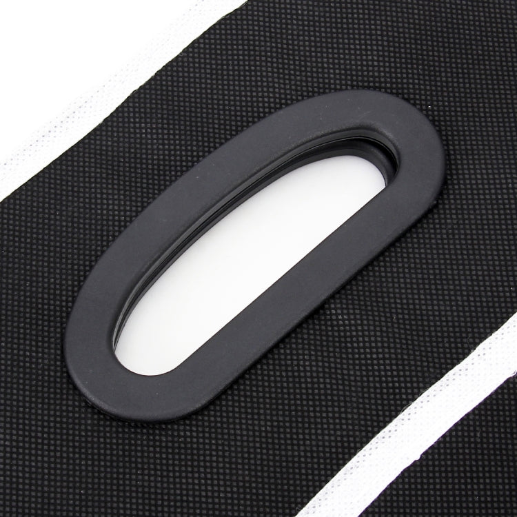 Black arched carry handle with white trim on foldable storage box organizer