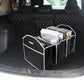 Foldable black trunk organizer storage box in vehicle cargo area with open compartments