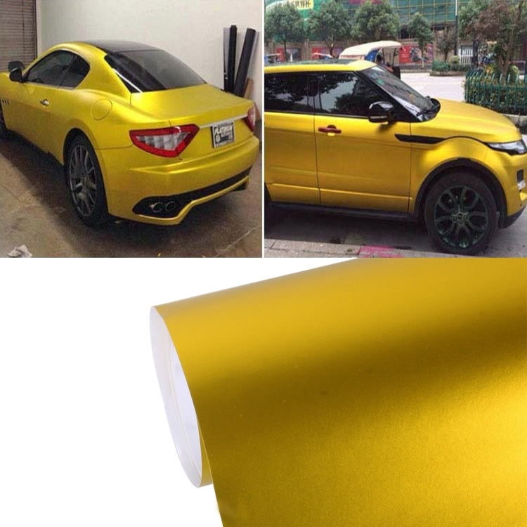 Gold metallic matte car vinyl wrap sheet with backing liner, roll corner visible