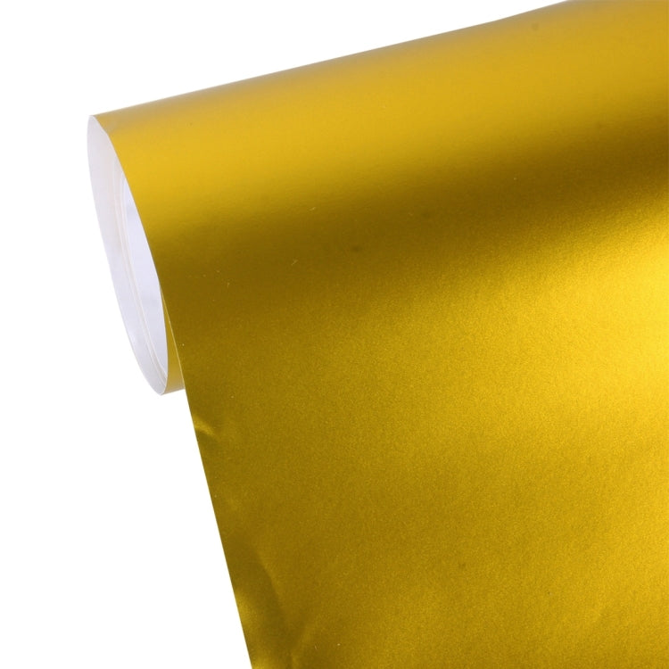 Gold metallic matte vinyl wrap sheet roll, close-up of rolled edge and texture