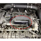 Engine bay view with circled area showing PCV delete plate placement