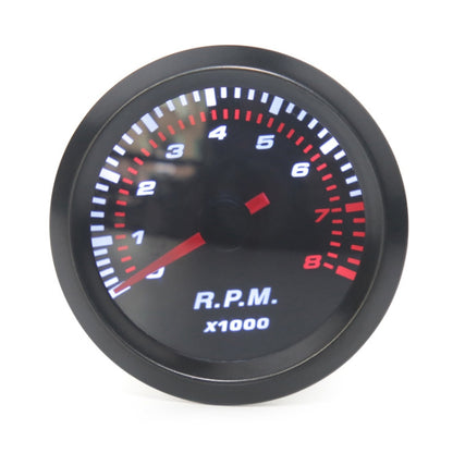 Universal tachometer gauge with RPM scale, black bezel, red needle and indicator