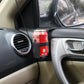 Car multifunction drink holder holding a red beverage cup near air vent