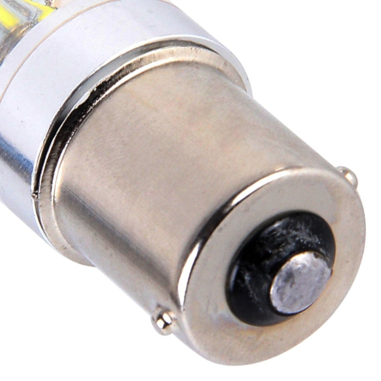 Close-up of LED car light bulb metal base with black contact and clear outer lens