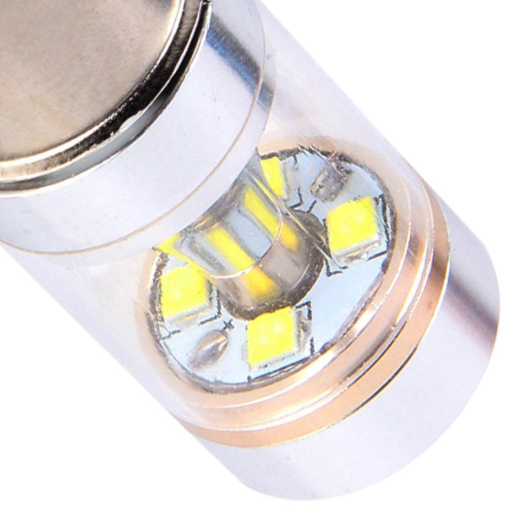 Close-up of LED car light bulb lens showing yellow LED chips and reflective interior