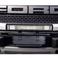 Universal license plate bumper frame bracket in black mounted on front bumper under an LED light