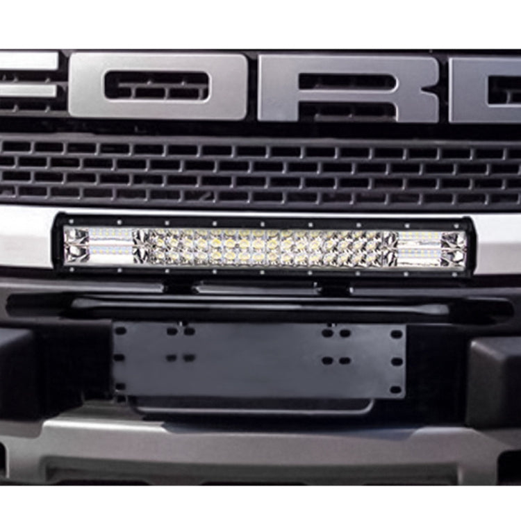Universal license plate bumper frame bracket in black mounted on front bumper under an LED light