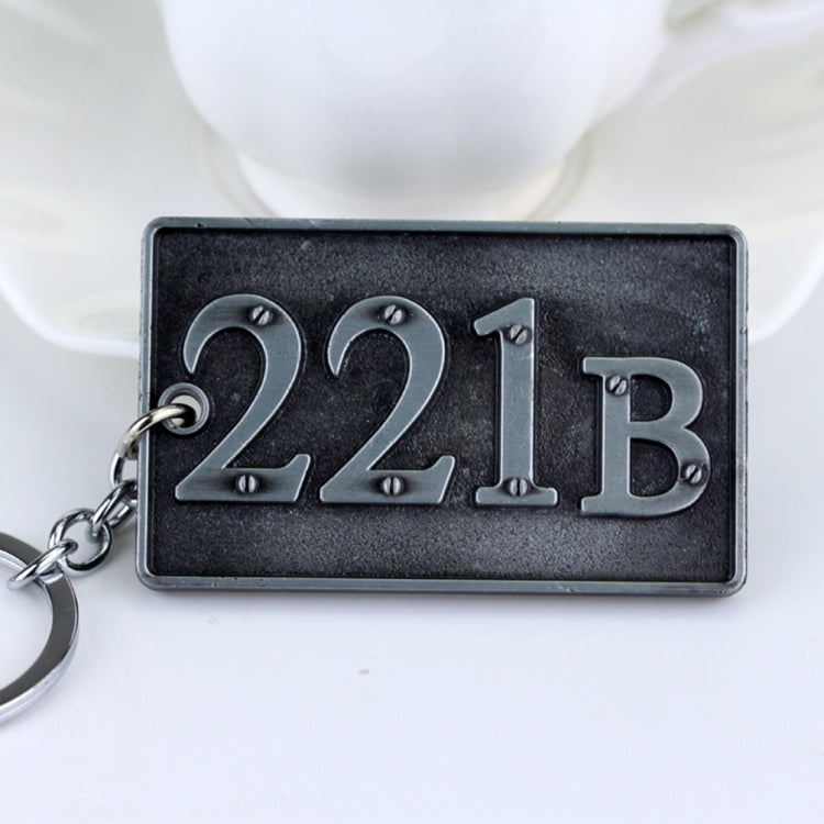 Metal keychain with large 221B lettering on dark rectangular plate