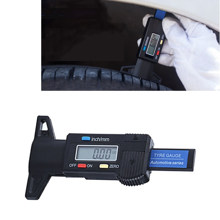 Blue digital tire tread depth gauge on black stand with LCD display