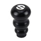 Black gourd-style gear shift knob with white shift pattern emblem on top