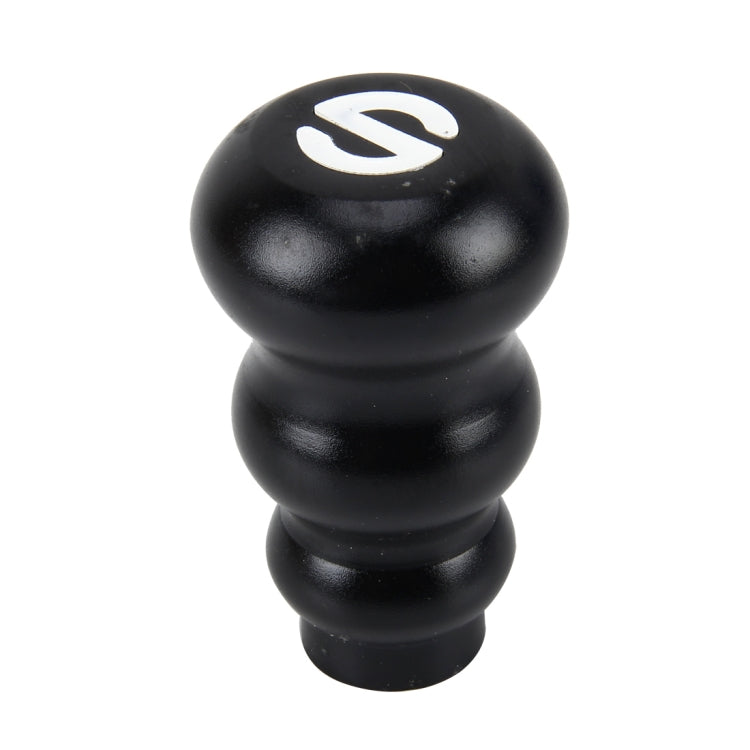 Black gourd-style gear shift knob with white shift pattern emblem on top