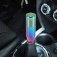 Rainbow metallic gear shift knob installed in a car interior