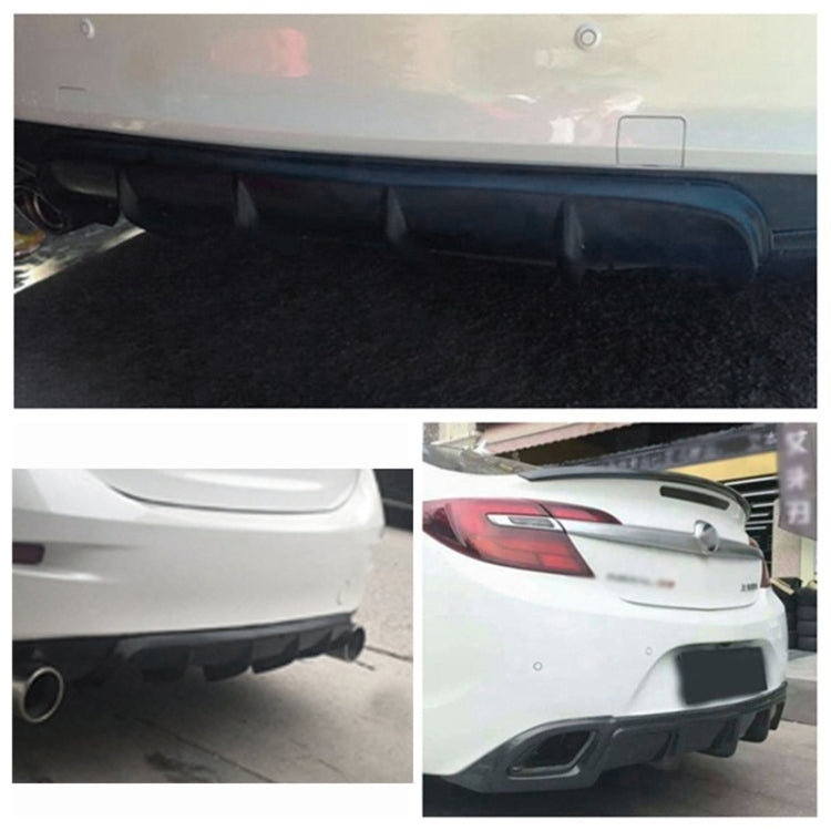 Black rear bumper lip diffuser installed on car rear, shark-fin style fins visible