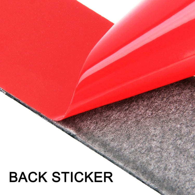 Carbon-fiber trim sticker edge with adhesive layer on a red surface
