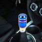 Blue car shifter knob with chrome rings and white base, installed on gear lever