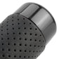Close-up of black perforated leather-textured grip on long car shift knob