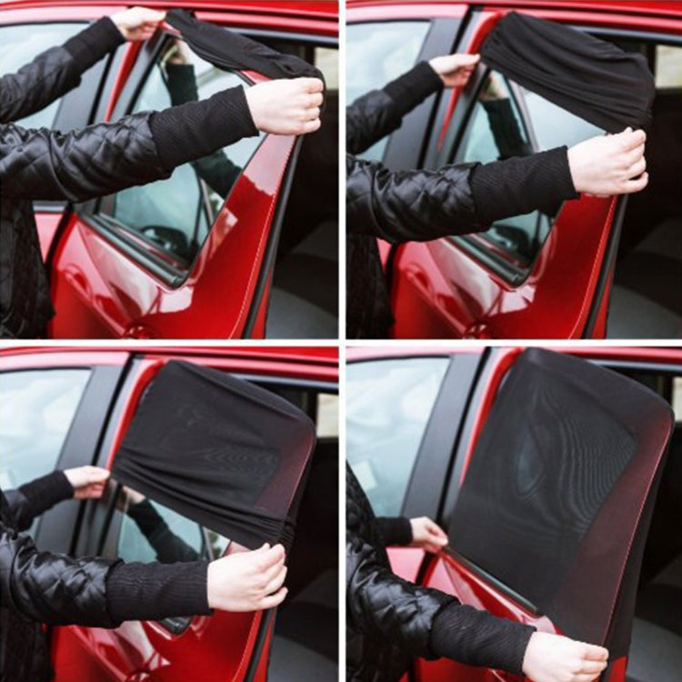 Black car window sunshade cover being installed over side window