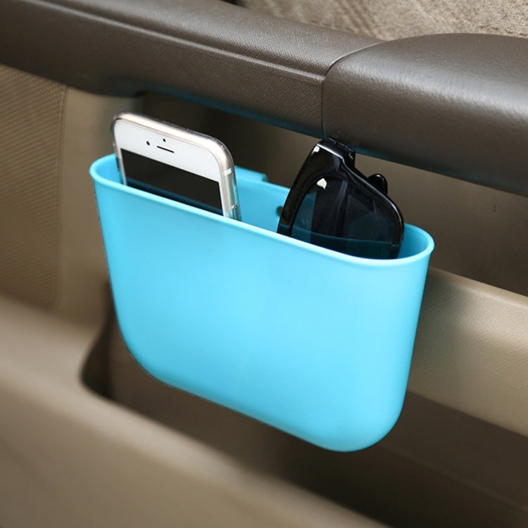 Blue car trash can organizer holding a smartphone and sunglasses in a cup holder