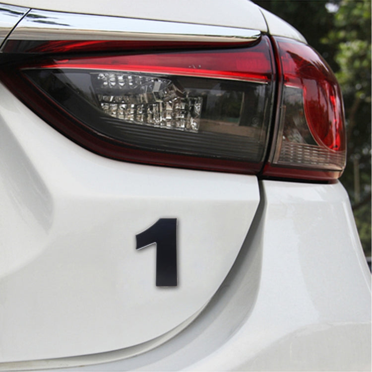 3D car number decal sticker with bold black “1” on a white vehicle panel