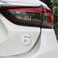 3D car number decal sticker with silver “6” on a white car panel