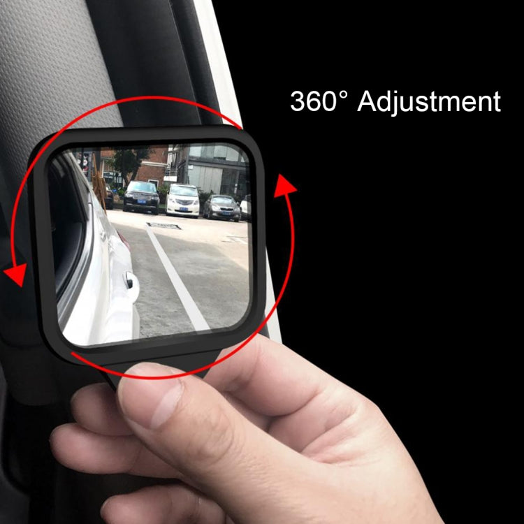 Adjustable blind spot mirror showing wide-view reflection on car window area