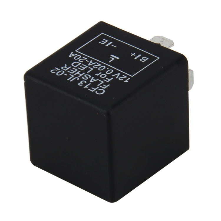 LED turn signal flasher relay, black cube with blue text and circuit markings