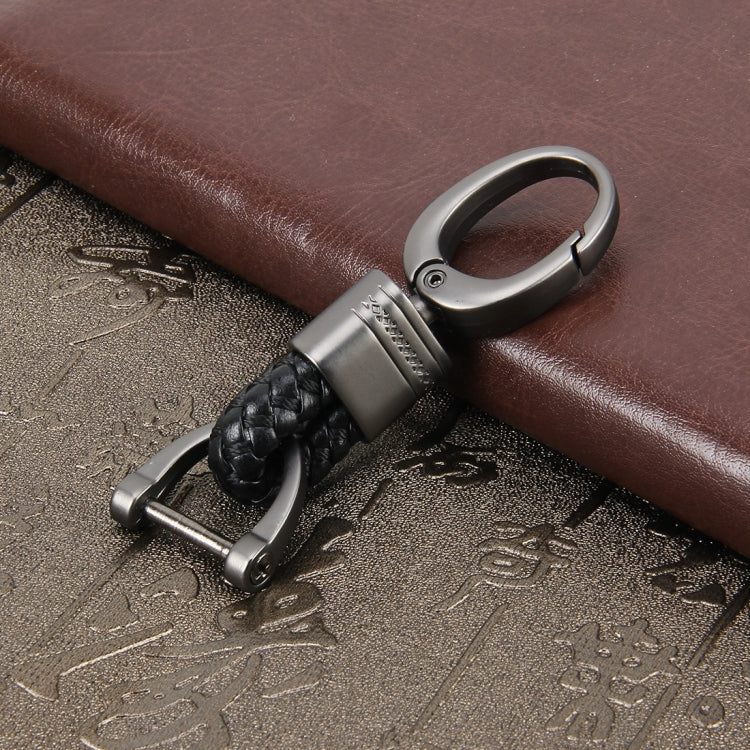 Braided leather keychain with metal key ring and belt-style snap clip, black braid