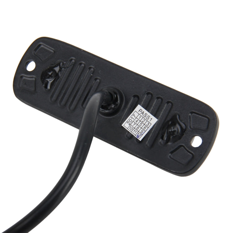 Black rear cover of LED strobe light with mounting holes and attached power cable