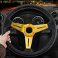 Black PU racing steering wheel with gold spokes and central horn pad