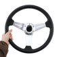 Black PU racing steering wheel with silver spokes and central horn pad
