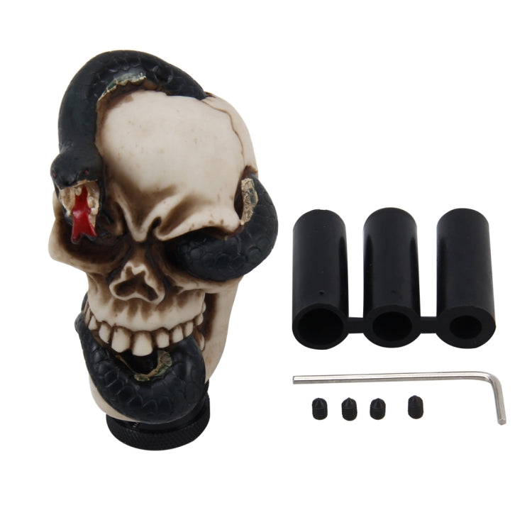 Resin skull gear shift knob kit with three caps, screws, and black textured base