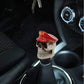 Resin skull gear shift knob with red sailor-style hat and textured base