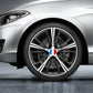 Round France flag wheel hub sticker centered on a multi-spoke alloy wheel